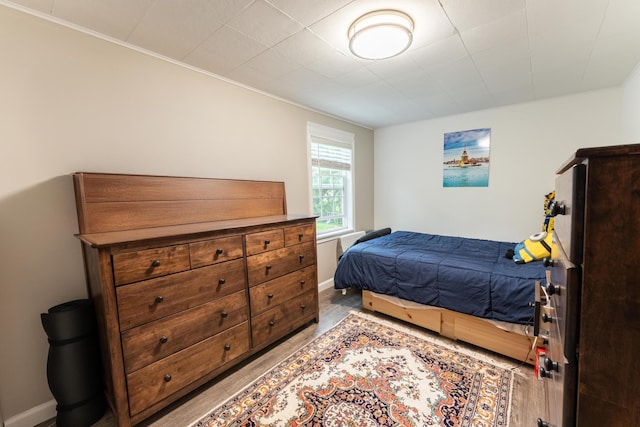 3300 Ellenboro Dr, Troy, MI 48083 - bedroom with ornamental molding and light wood finished floors