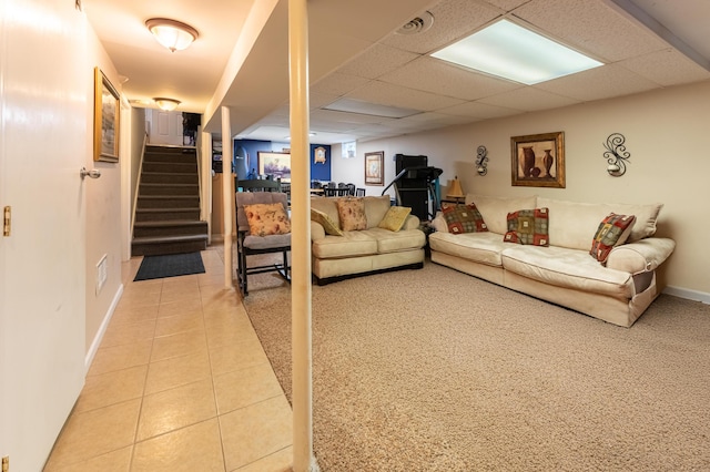 3300 Ellenboro Dr, Troy, MI 48083 - living area featuring light tile patterned floors, a paneled ceiling, stairway, and baseboards