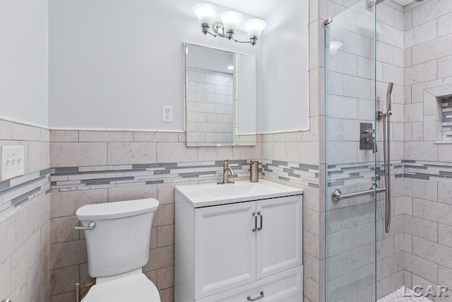 1706 Southgate Ct, Adrian, MI 49221 - full bath with a stall shower, vanity, toilet, a chandelier, and wainscoting