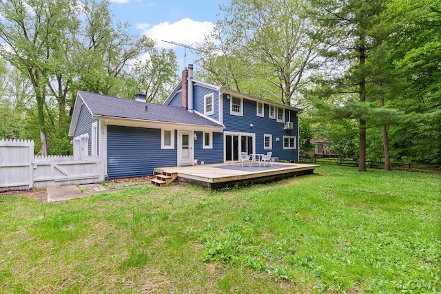 1706 Southgate Ct, Adrian, MI 49221 - rear view of property featuring a chimney and a wooden deck