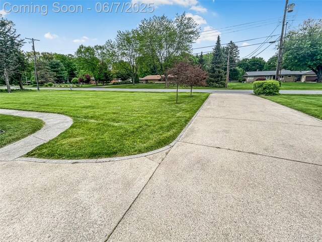 2211 N Sycamore Dr, Burton, MI 48509 - surrounding community with a lawn