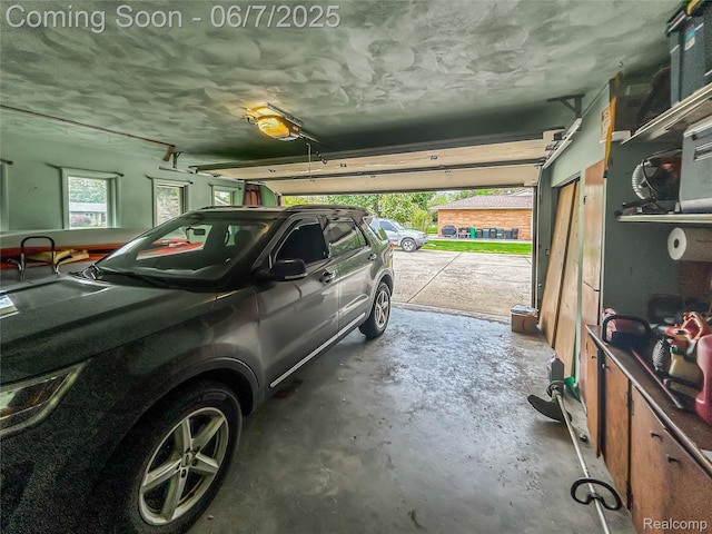 2211 N Sycamore Dr, Burton, MI 48509 - garage with a garage door opener