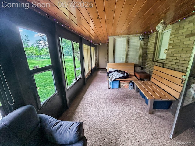 2211 N Sycamore Dr, Burton, MI 48509 - sunroom / solarium featuring brick wall, wooden ceiling, and carpet floors