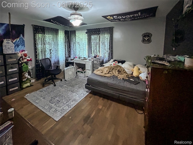 2211 N Sycamore Dr, Burton, MI 48509 - bedroom with wood finished floors and an office area