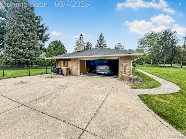 2211 N Sycamore Dr, Burton, MI 48509 - garage featuring driveway