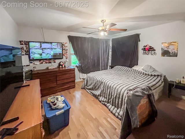2211 N Sycamore Dr, Burton, MI 48509 - bedroom featuring wood finished floors and a ceiling fan