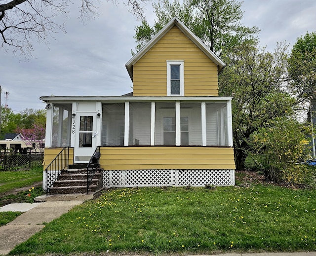 228 Meachem Ave, Battle Creek, MI 49015 - view of front of property featuring a front yard and a sunroom