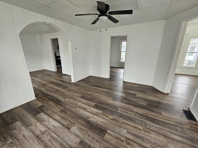 228 Meachem Ave, Battle Creek, MI 49015 - unfurnished room with healthy amount of natural light, arched walkways, dark wood-type flooring, and a ceiling fan