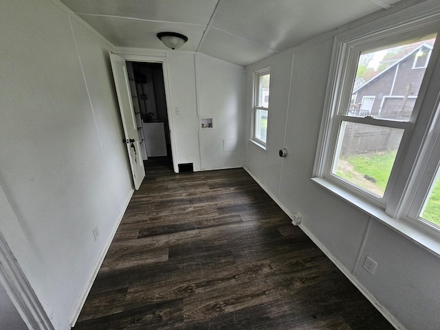 228 Meachem Ave, Battle Creek, MI 49015 - spare room featuring healthy amount of natural light, dark wood finished floors, and vaulted ceiling