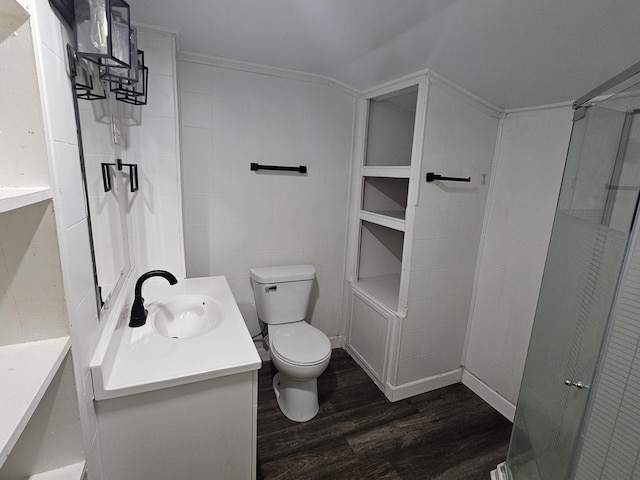 228 Meachem Ave, Battle Creek, MI 49015 - bathroom featuring wood finished floors, toilet, vanity, and a shower