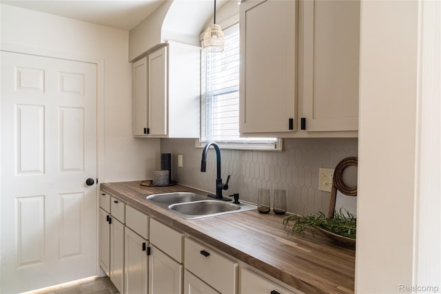 16230 Santa Rosa Dr, Detroit, MI 48221 - kitchen with a sink, decorative backsplash, and wood counters