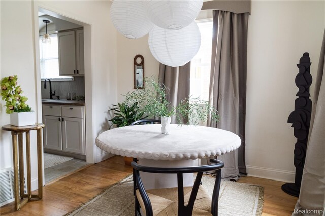 16230 Santa Rosa Dr, Detroit, MI 48221 - dining area featuring light wood-style floors and baseboards