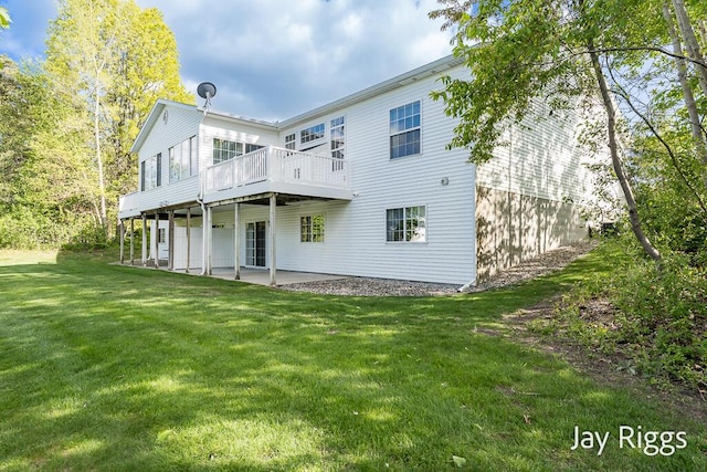 2632 E Turning Leaf Way Unit 111, Fruitport, MI 49415 - back of property with a lawn, a patio, and a wooden deck