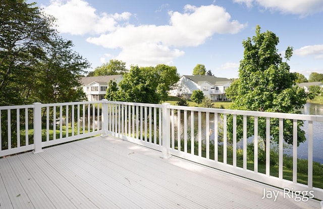 2632 E Turning Leaf Way Unit 111, Fruitport, MI 49415 - wooden deck featuring a residential view and a water view