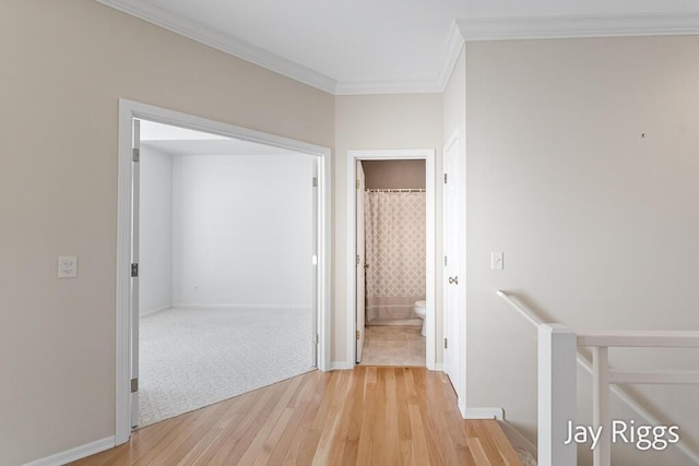 2632 E Turning Leaf Way Unit 111, Fruitport, MI 49415 - hall with light wood-type flooring, ornamental molding, baseboards, and an upstairs landing