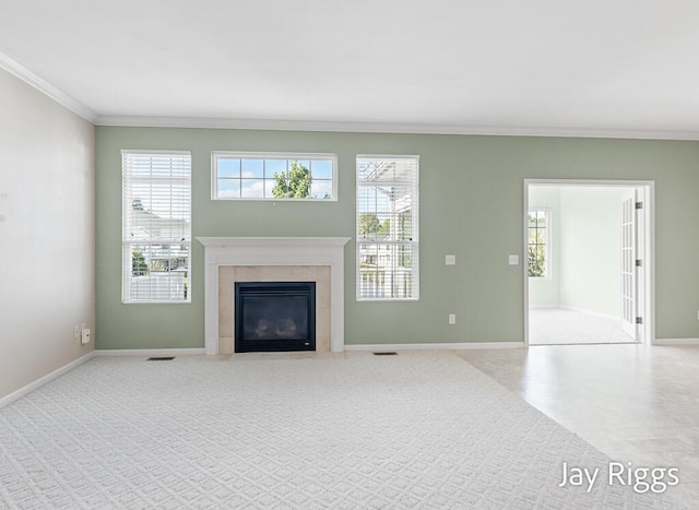 2632 E Turning Leaf Way Unit 111, Fruitport, MI 49415 - unfurnished living room featuring crown molding, baseboards, plenty of natural light, and a fireplace
