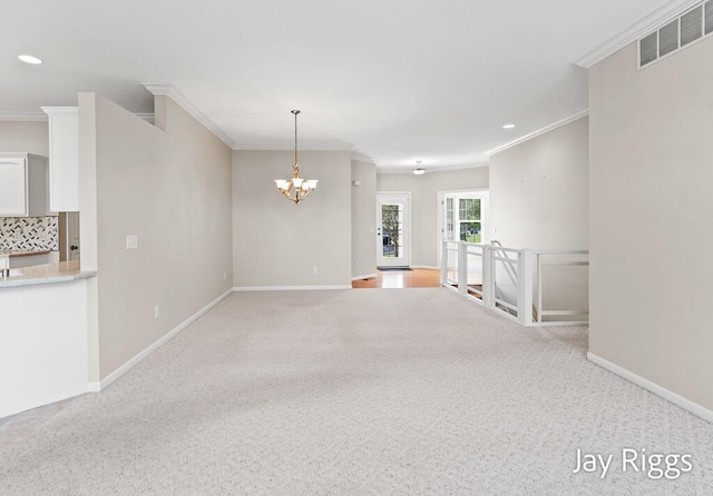 2632 E Turning Leaf Way Unit 111, Fruitport, MI 49415 - empty room featuring light colored carpet, a chandelier, crown molding, baseboards, and recessed lighting