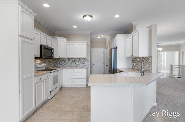 2632 E Turning Leaf Way Unit 111, Fruitport, MI 49415 - kitchen featuring appliances with stainless steel finishes, a sink, a peninsula, ornamental molding, and light tile patterned flooring
