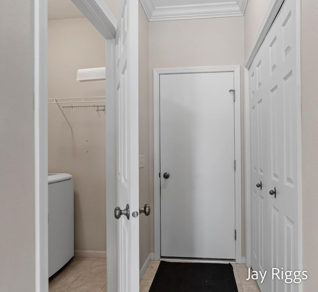 2632 E Turning Leaf Way Unit 111, Fruitport, MI 49415 - corridor featuring ornamental molding, light tile patterned floors, washer / clothes dryer, and baseboards