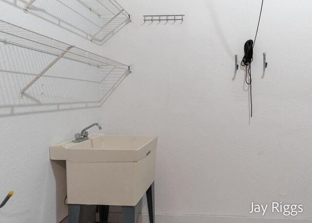 2632 E Turning Leaf Way Unit 111, Fruitport, MI 49415 - laundry room with a sink