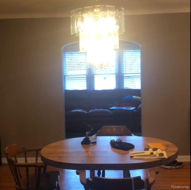 8312 E Outer Dr, Detroit, MI 48213 - dining area with a chandelier and wood finished floors