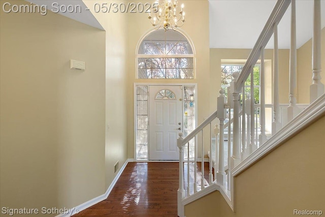 31190 Kingsley Ct, Novi, MI 48377 - entrance foyer featuring stairs, a chandelier, wood finished floors, and a high ceiling