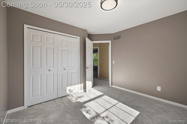 31190 Kingsley Ct, Novi, MI 48377 - unfurnished bedroom featuring carpet floors, a closet, and baseboards