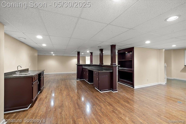 31190 Kingsley Ct, Novi, MI 48377 - indoor wet bar with dark wood-type flooring, recessed lighting, and a paneled ceiling