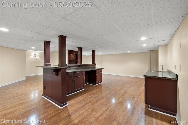 31190 Kingsley Ct, Novi, MI 48377 - indoor wet bar with a drop ceiling and wood finished floors