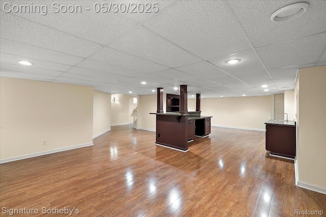 31190 Kingsley Ct, Novi, MI 48377 - finished below grade area featuring wet bar, wood finished floors, and a paneled ceiling