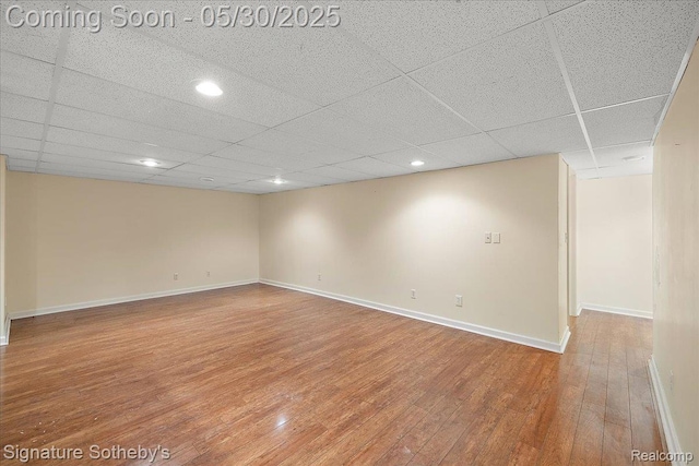 31190 Kingsley Ct, Novi, MI 48377 - empty room featuring hardwood / wood-style flooring, a paneled ceiling, and recessed lighting