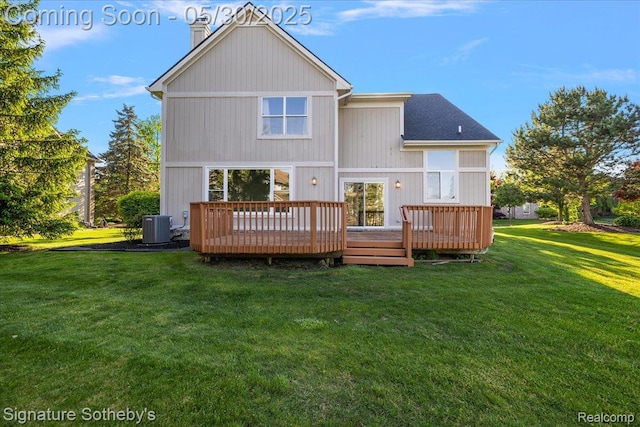 31190 Kingsley Ct, Novi, MI 48377 - rear view of house with a chimney, a lawn, and a deck