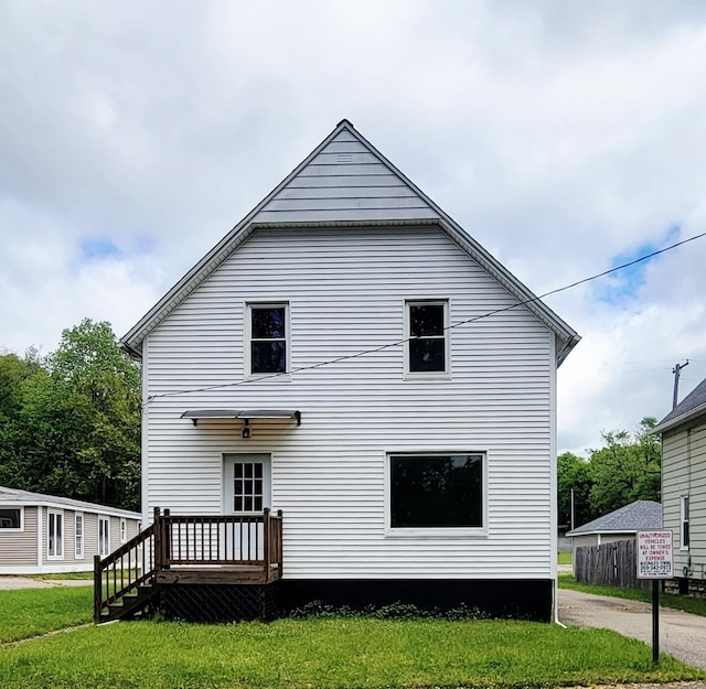 2109 Schippers Ln, Kalamazoo, MI 49048 - view of property exterior featuring a wooden deck and a yard