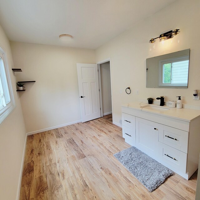 2109 Schippers Ln, Kalamazoo, MI 49048 - bathroom featuring vanity, wood finished floors, and baseboards