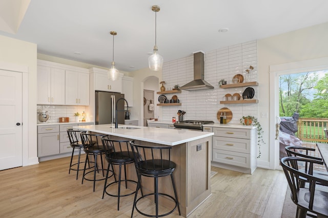 1819 Gloryfield Dr SW, Byron Center, MI 49315 - kitchen with wall chimney range hood, open shelves, stainless steel appliances, and gray cabinets