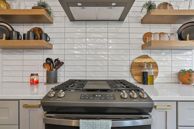 1819 Gloryfield Dr SW, Byron Center, MI 49315 - kitchen with stainless steel gas range, ventilation hood, tasteful backsplash, and open shelves