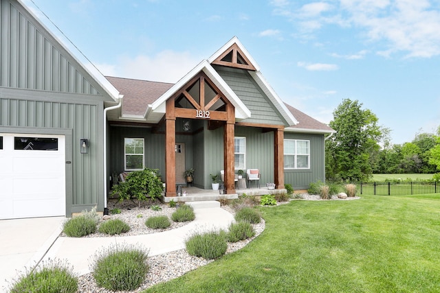 1819 Gloryfield Dr SW, Byron Center, MI 49315 - view of front of property with covered porch, board and batten siding, and a garage