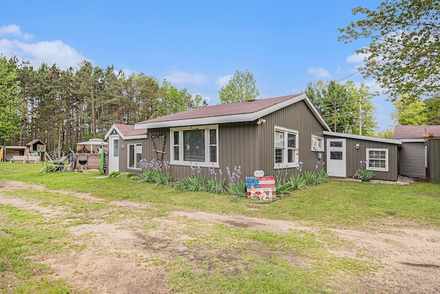 19030 W Almy Rd, Howard City, MI 49329 - view of front of property with a front lawn