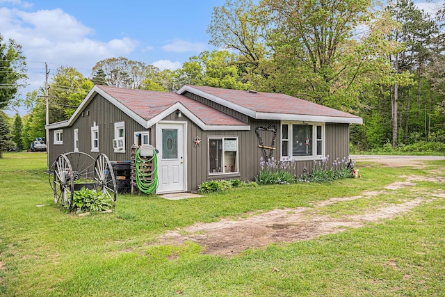 19030 W Almy Rd, Howard City, MI 49329 - view of front of home with a front yard and board and batten siding