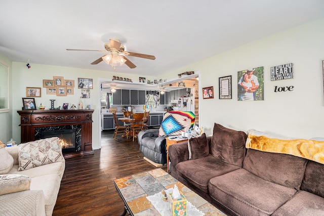 19030 W Almy Rd, Howard City, MI 49329 - living room with wood-type flooring, a ceiling fan, and a high end fireplace