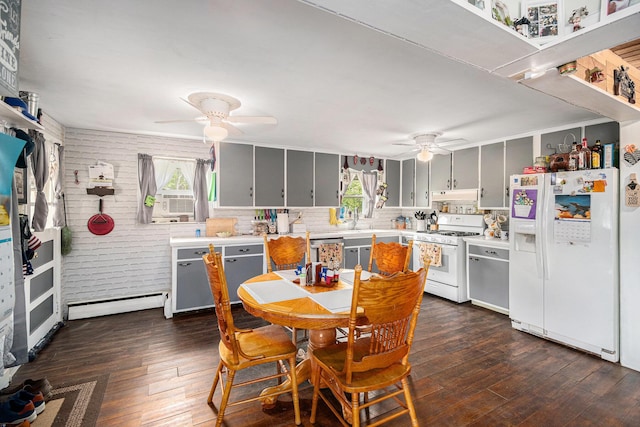 19030 W Almy Rd, Howard City, MI 49329 - kitchen with white appliances, a ceiling fan, a baseboard radiator, light countertops, and dark wood-type flooring