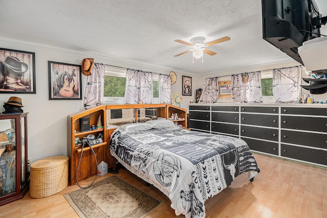 19030 W Almy Rd, Howard City, MI 49329 - bedroom featuring wood finished floors, crown molding, and a ceiling fan