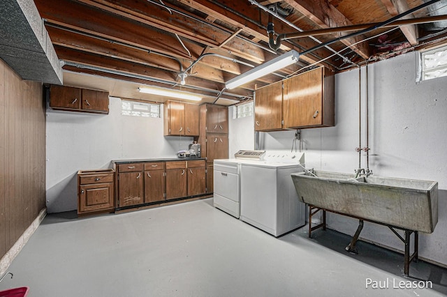 1043 Eastern Ave NE, Grand Rapids, MI 49503 - laundry area featuring separate washer and dryer, cabinet space, and plenty of natural light
