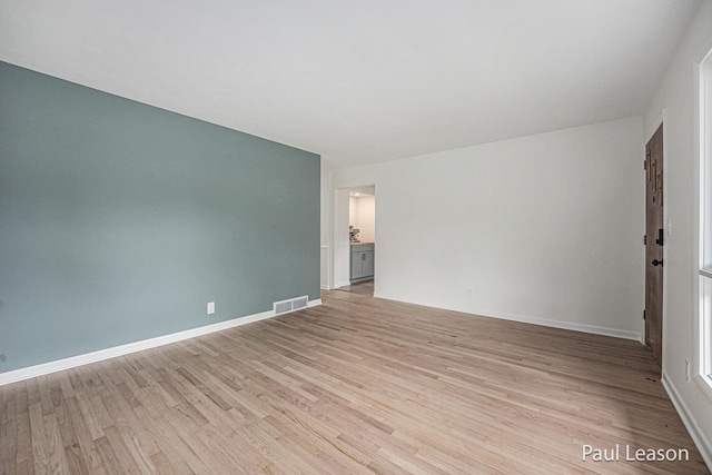 1043 Eastern Ave NE, Grand Rapids, MI 49503 - spare room featuring light wood-style flooring and baseboards