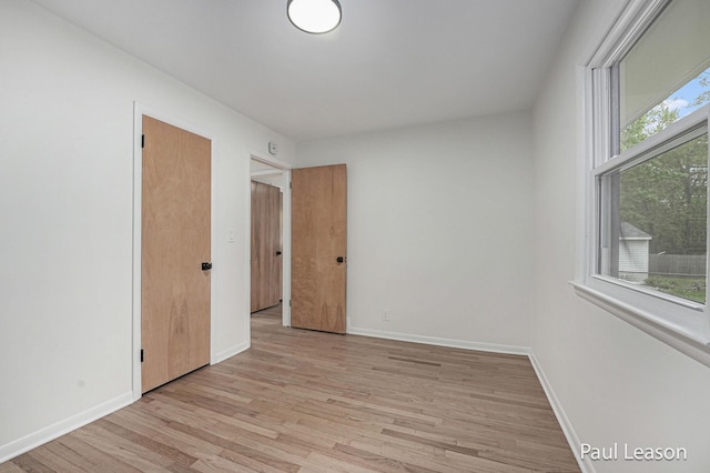 1043 Eastern Ave NE, Grand Rapids, MI 49503 - spare room with light wood-style floors and baseboards
