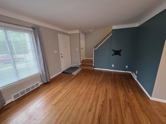 1516 W Webster Rd, Royal Oak, MI 48073 - foyer featuring stairway, healthy amount of natural light, wood finished floors, and baseboards