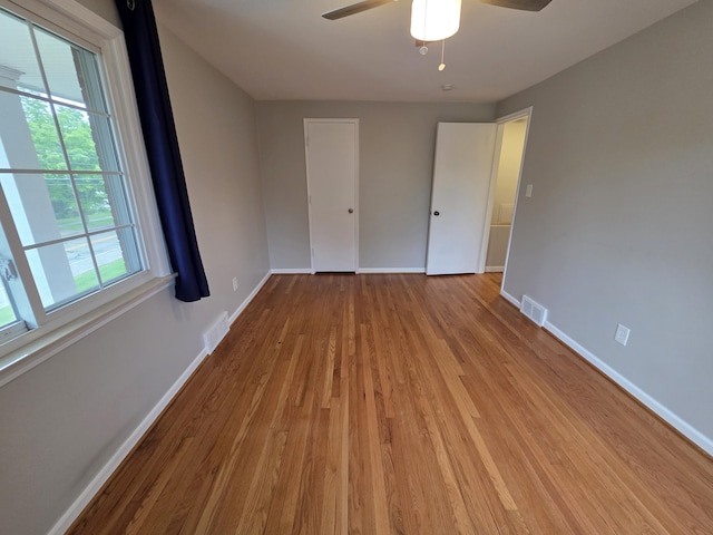 1516 W Webster Rd, Royal Oak, MI 48073 - unfurnished bedroom with wood finished floors, baseboards, and ceiling fan