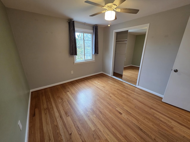 1516 W Webster Rd, Royal Oak, MI 48073 - unfurnished bedroom with baseboards, light wood-style flooring, a closet, and ceiling fan