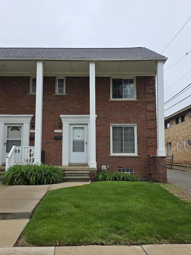 1516 W Webster Rd, Royal Oak, MI 48073 - greek revival inspired property with a front lawn and brick siding