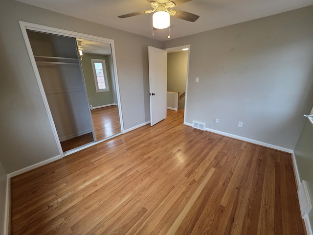 1516 W Webster Rd, Royal Oak, MI 48073 - unfurnished bedroom featuring light wood finished floors, baseboards, a closet, and ceiling fan